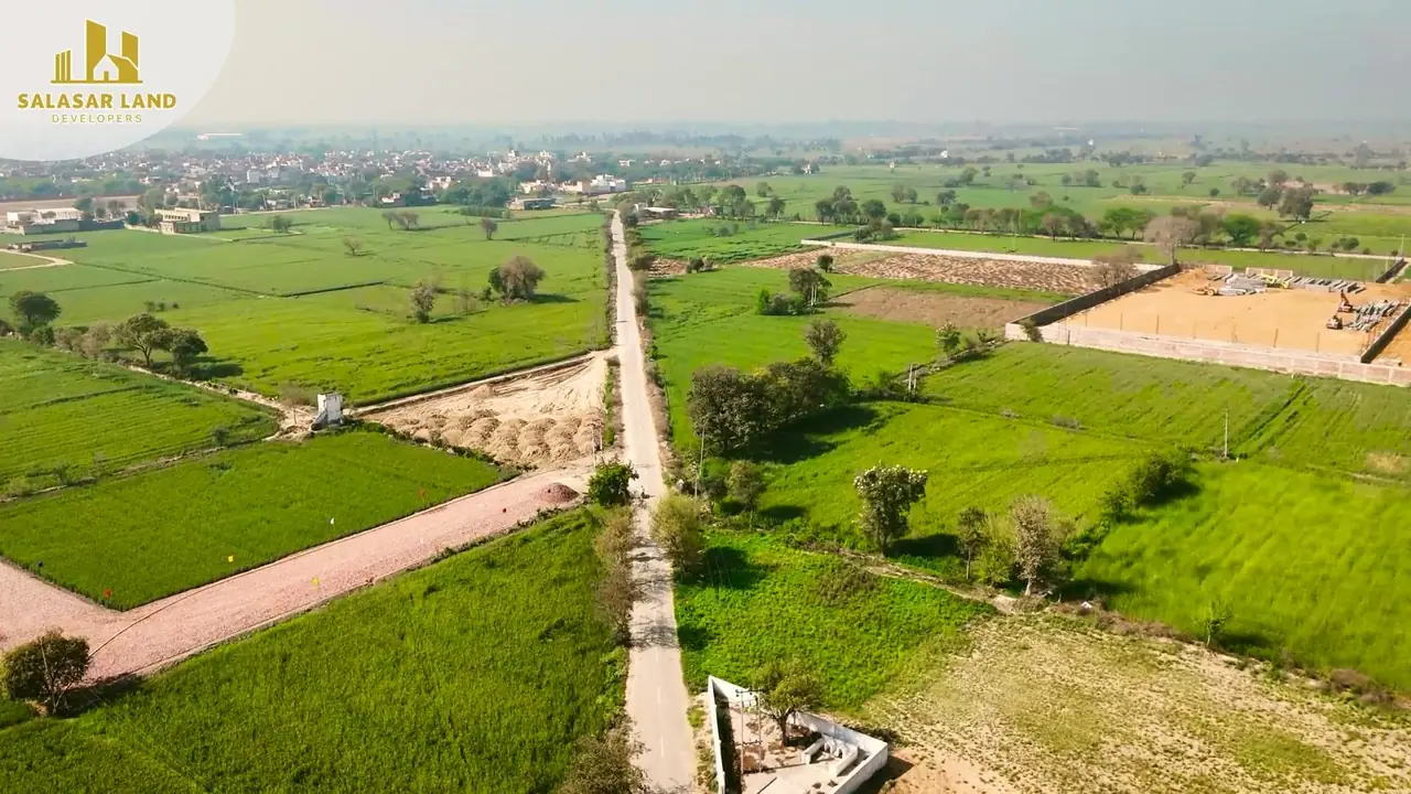 Aerial view of the surrounding fields and approach road
